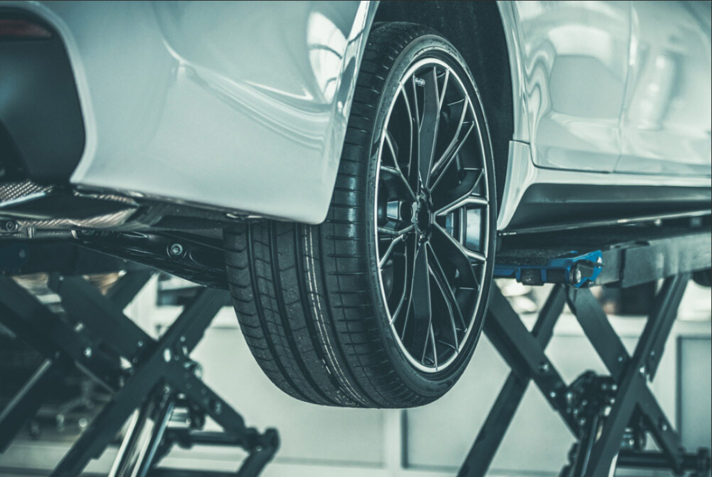 A car in the process of a tire rotation being done at Coeur d'Alene Honda.