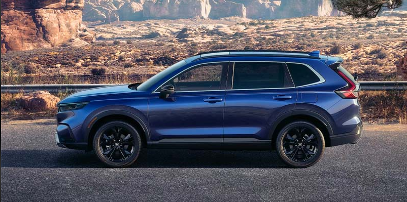 A Blue CR-V Hybrid parked on the side of the road.