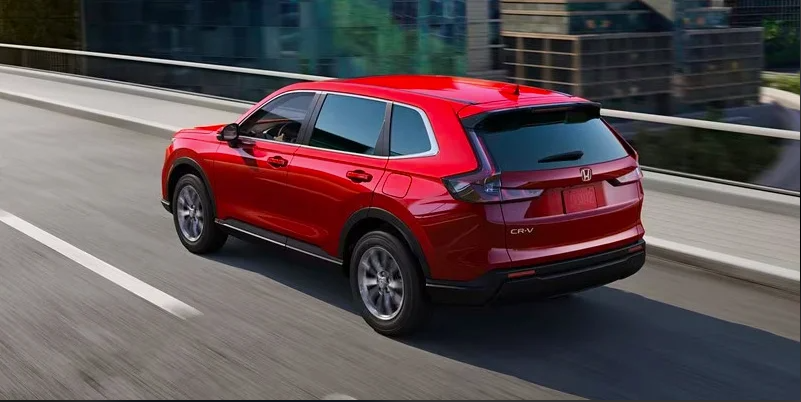 A red 2024 Honda CR-V driving down the road near Coeur d'Alene Honda.