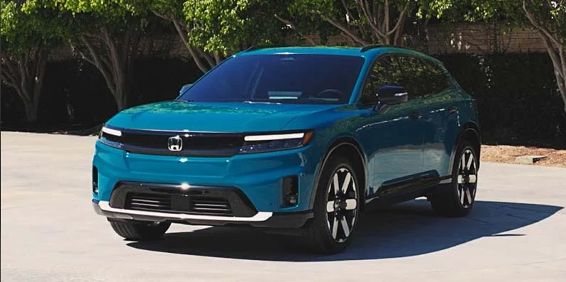 A blue 2024 Honda Prologue parked diagonally from the camera.