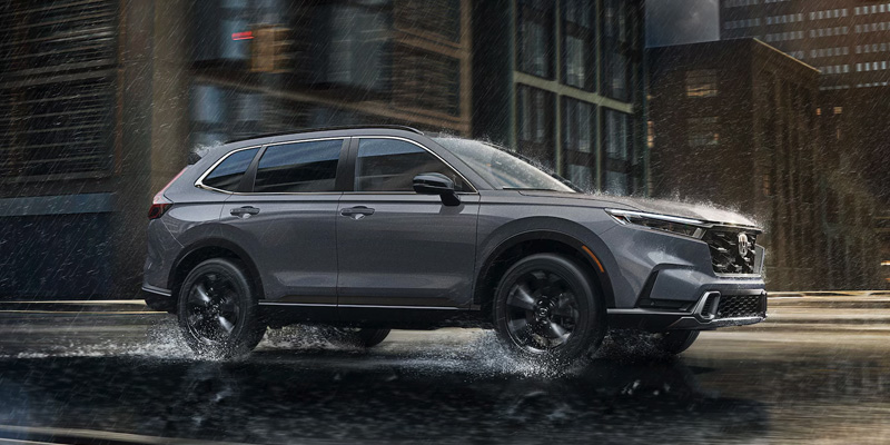A gray 2025 Honda CR-V driving through the rain near Coeur d'Alene, ID