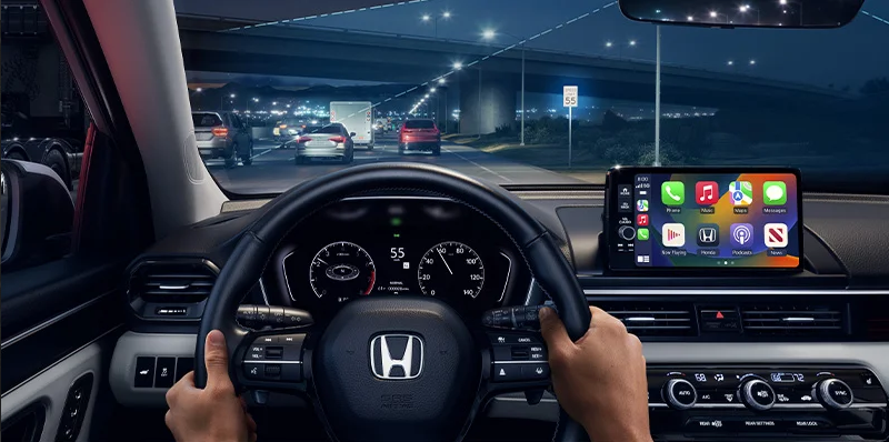 A photo from the drivers point of view of the road.