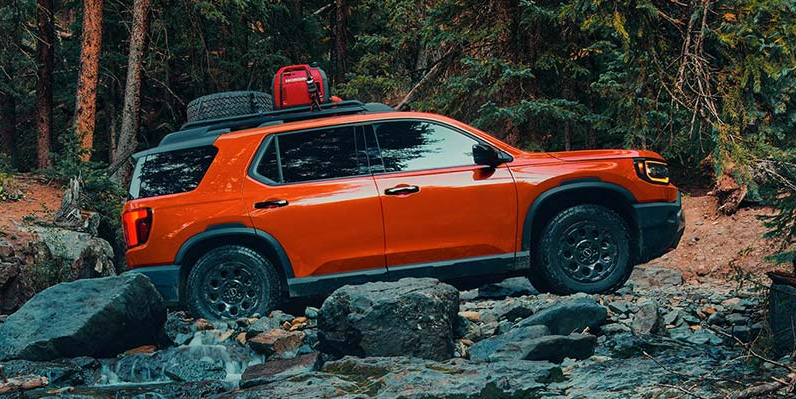 A photo of a 2026 Honda Passport off-roading.