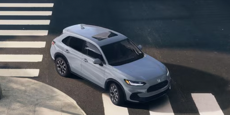 Grey 2026 Honda HR-V turning on the road 