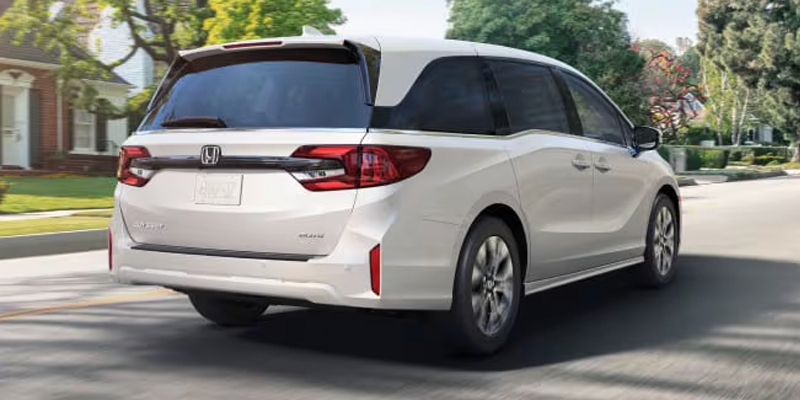 2026 White Honda Odyssey in it's back profile
