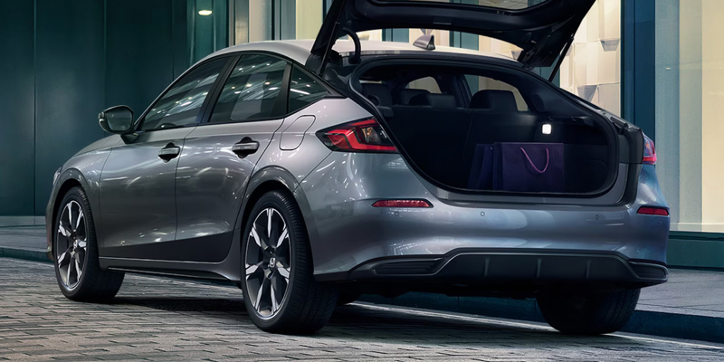 2026 Grey Honda Civic Hatchback in it's back profile in open boot space